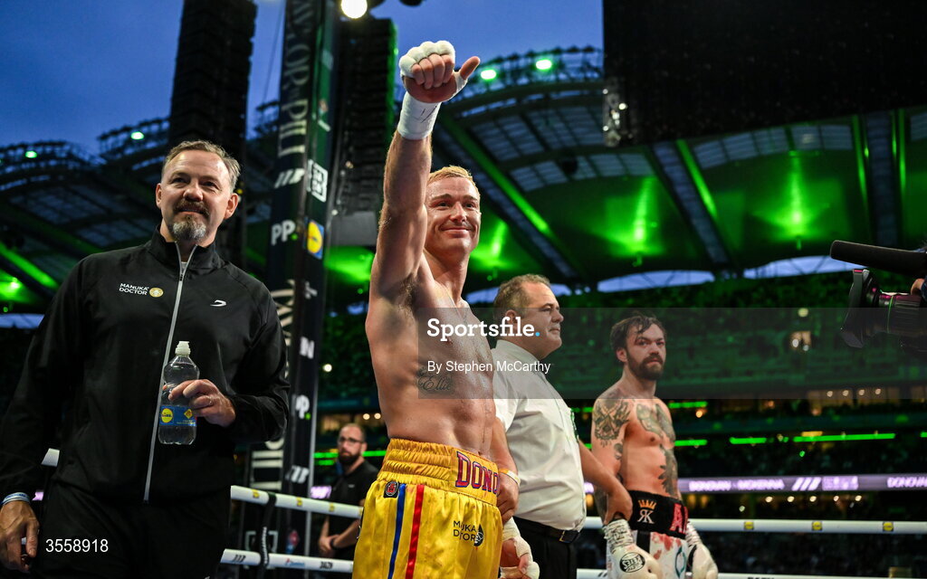 5 September 2026; Paddy Donovan, centre, celebrates with his trainer Andy Lee after being declared victorious in his welterweight bout with Tyrone McKenna at the Once Upon A Time fight night in Croke Park, Dublin. Photo by Stephen McCarthy/Sportsfile