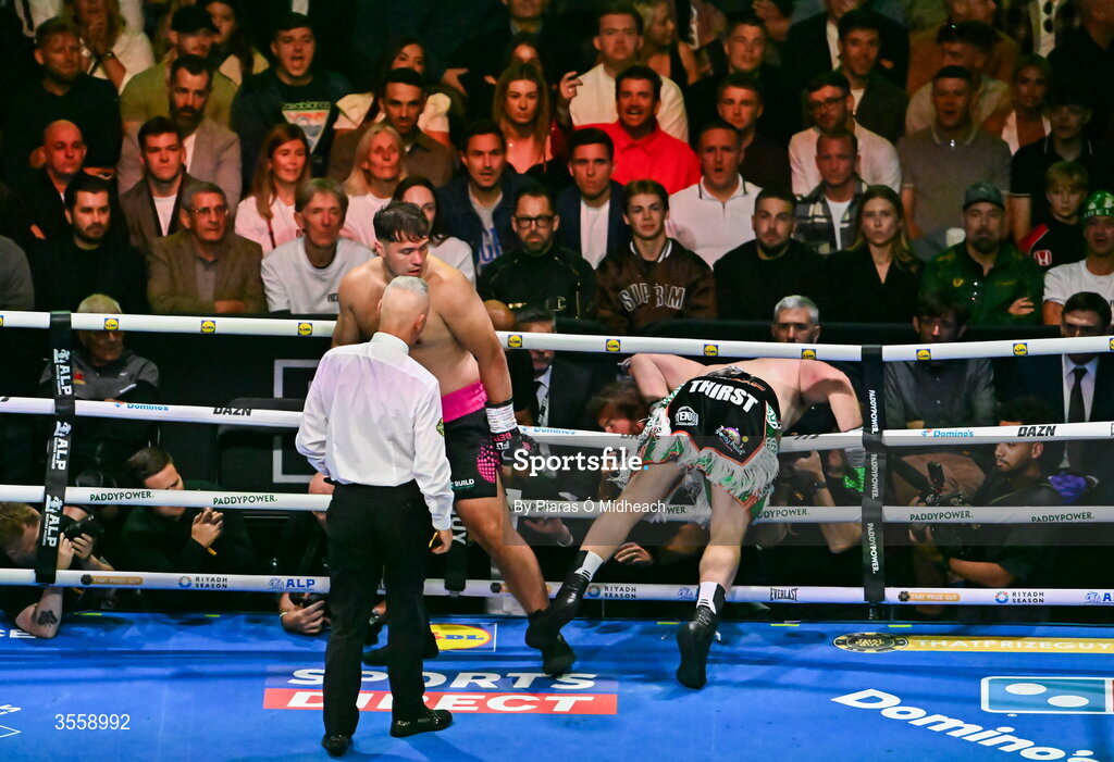 5 September 2026; Thomas Carty is knocked through the ropes by Dave Allen during their heavyweight bout at the Once Upon A Time fight night in Croke Park, Dublin. Photo by Piaras Ó Mídheach/Sportsfile