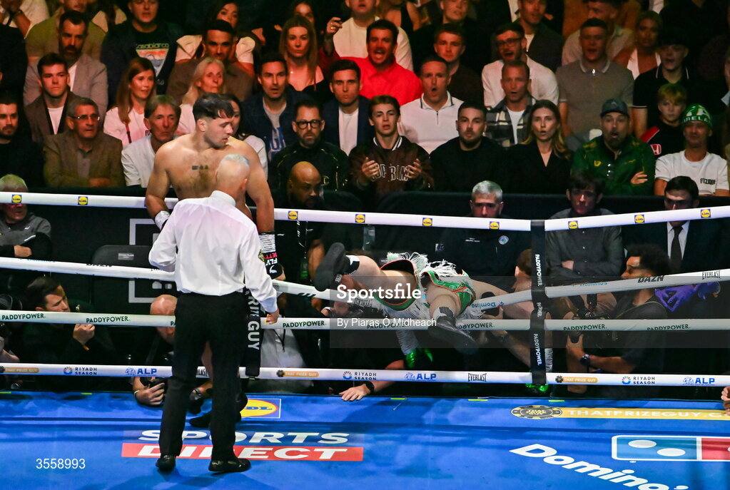 5 September 2026; Thomas Carty is knocked through the ropes by Dave Allen during their heavyweight bout at the Once Upon A Time fight night in Croke Park, Dublin. Photo by Piaras Ó Mídheach/Sportsfile