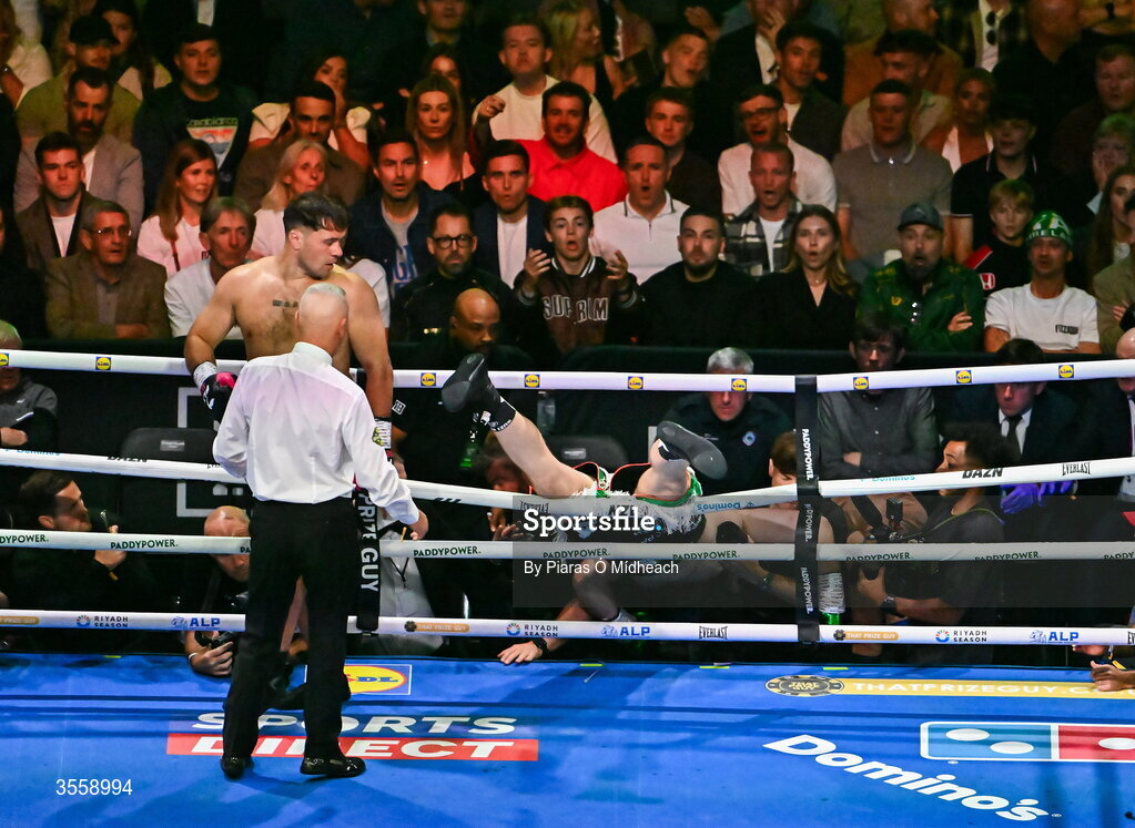 5 September 2026; Thomas Carty is knocked through the ropes by Dave Allen during their heavyweight bout at the Once Upon A Time fight night in Croke Park, Dublin. Photo by Piaras Ó Mídheach/Sportsfile
