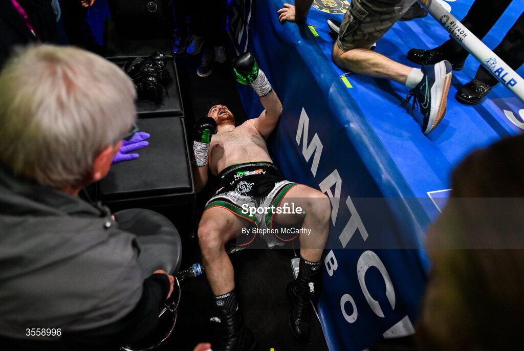 5 September 2026; Thomas Carty is knocked through the ring ropes during his heavyweight bout by Dave Allen at the Once Upon A Time fight night in Croke Park, Dublin. Photo by Stephen McCarthy/Sportsfile