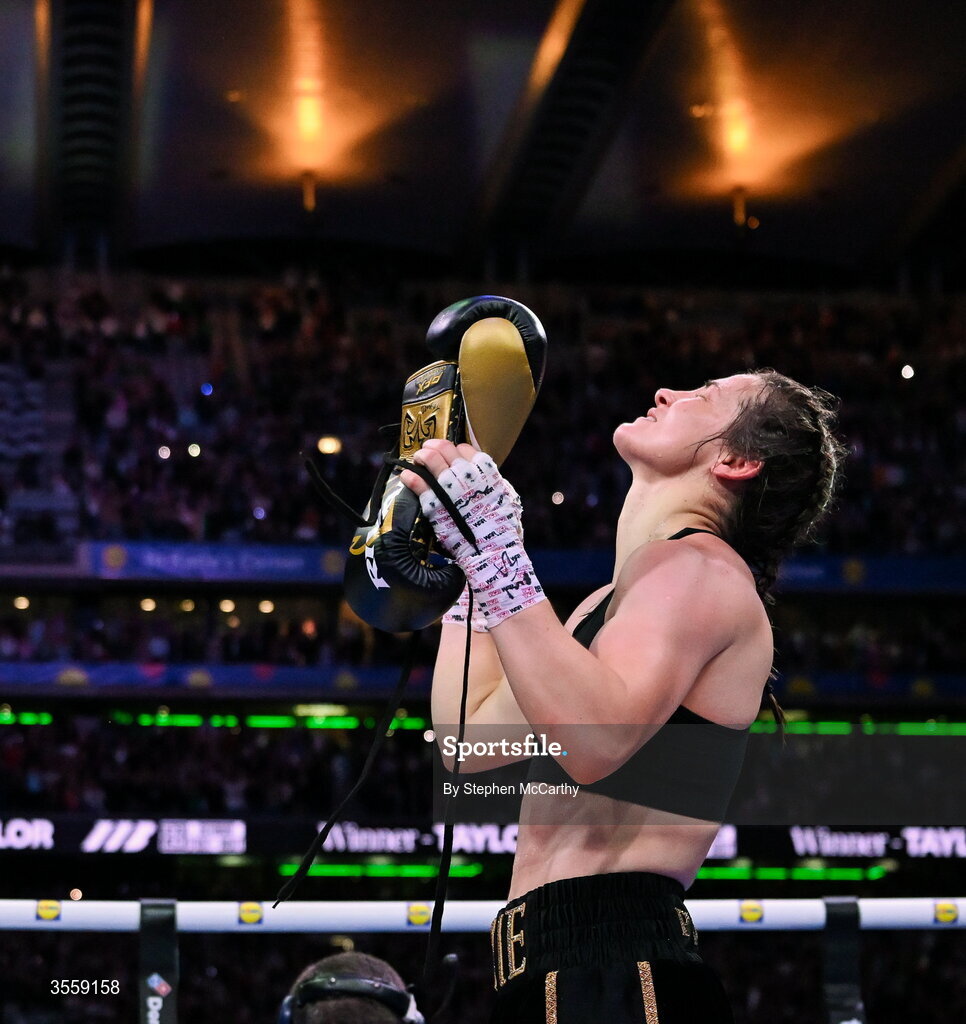 5 September 2026; Katie Taylor places her gloves onto the centre of the ring after her undisputed super lightweight championship fight with Flora Pili at the Once Upon A Time fight night in Croke Park, Dublin. Photo by Stephen McCarthy/Sportsfile