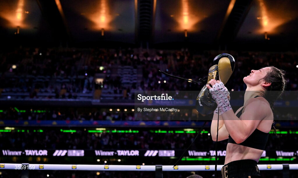 5 September 2026; Katie Taylor places her gloves onto the centre of the ring after her undisputed super lightweight championship fight with Flora Pili at the Once Upon A Time fight night in Croke Park, Dublin. Photo by Stephen McCarthy/Sportsfile