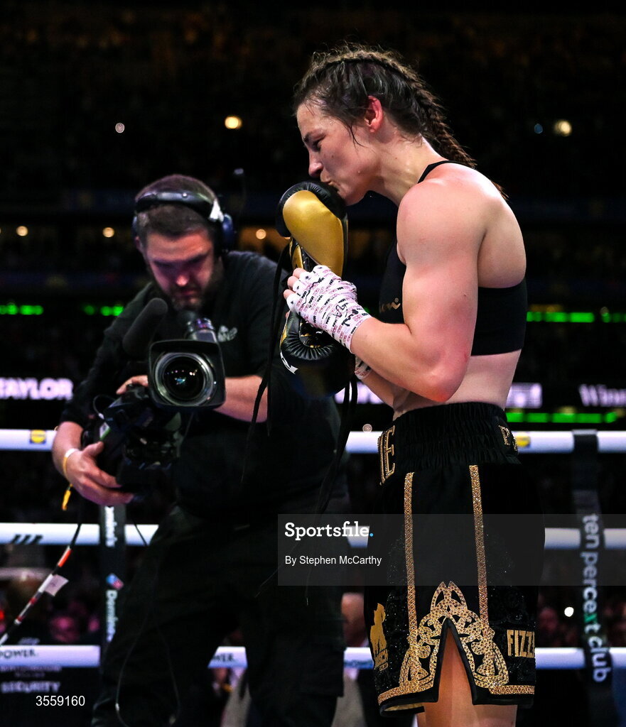 5 September 2026; Katie Taylor places her gloves onto the centre of the ring after her undisputed super lightweight championship fight with Flora Pili at the Once Upon A Time fight night in Croke Park, Dublin. Photo by Stephen McCarthy/Sportsfile