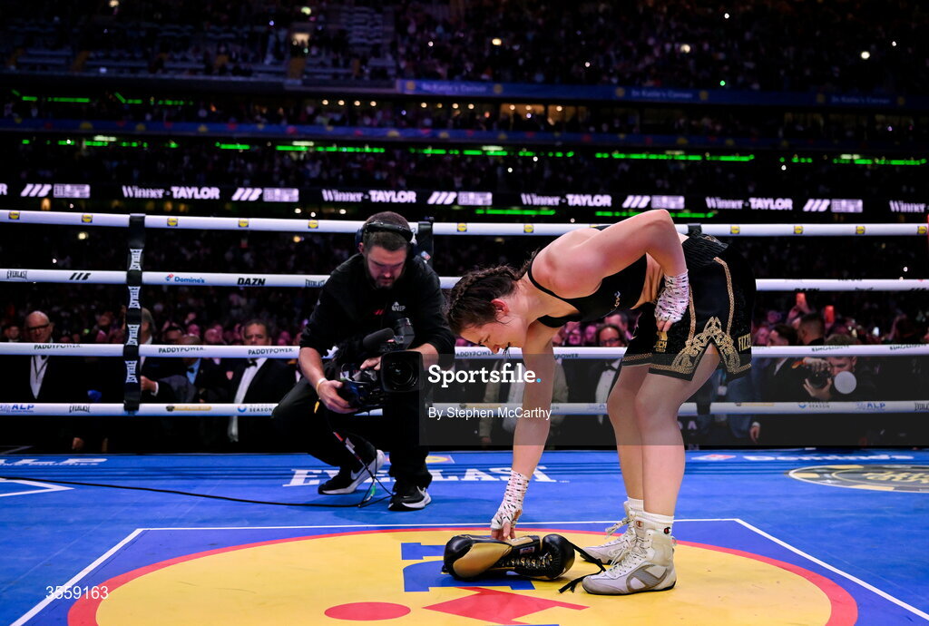 5 September 2026; Katie Taylor places her gloves onto the centre of the ring after her undisputed super lightweight championship fight with Flora Pili at the Once Upon A Time fight night in Croke Park, Dublin. Photo by Stephen McCarthy/Sportsfile