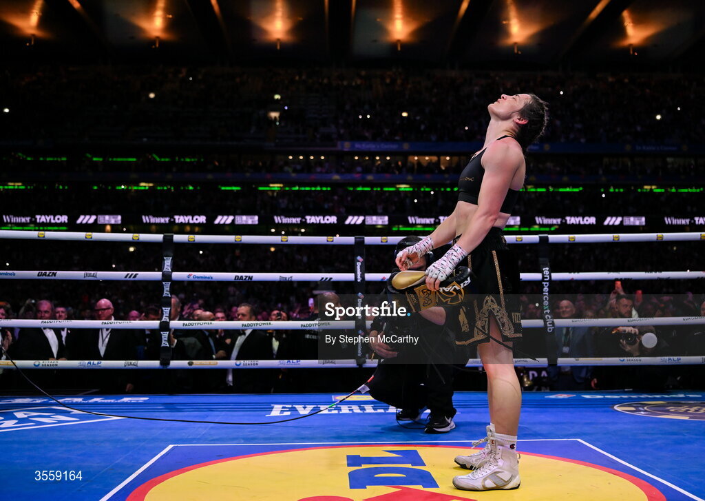 5 September 2026; Katie Taylor places her gloves onto the centre of the ring after her undisputed super lightweight championship fight with Flora Pili at the Once Upon A Time fight night in Croke Park, Dublin. Photo by Stephen McCarthy/Sportsfile