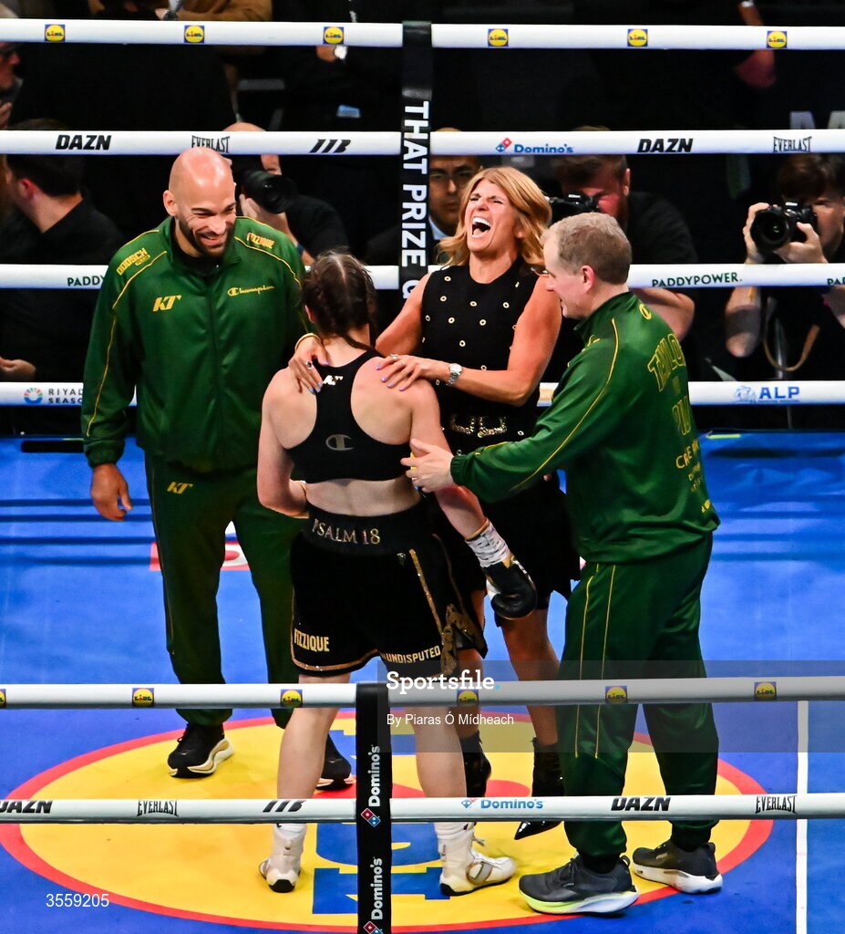 5 September 2026; Katie Taylor, left, celebrates with her manager Brian Peters, right, and mother Bridget Taylor after her undisputed super lightweight championship fight with Flora Pili at the Once Upon A Time fight night in Croke Park, Dublin. Photo by Piaras Ó Mídheach/Sportsfile