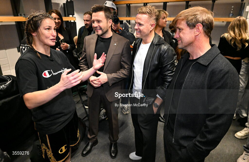 5 September 2026; Katie Taylor, left, with from left, Shane Filan, Nicky Byrne and Kian Egan of Westlife after her undisputed super lightweight championship fight with Flora Pili at the Once Upon A Time fight night in Croke Park, Dublin. Photo by Stephen McCarthy/Sportsfile