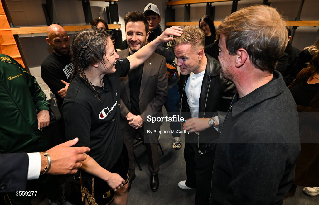 5 September 2026; Katie Taylor, left, with from left, Shane Filan, Nicky Byrne and Kian Egan of Westlife after her undisputed super lightweight championship fight with Flora Pili at the Once Upon A Time fight night in Croke Park, Dublin. Photo by Stephen McCarthy/Sportsfile