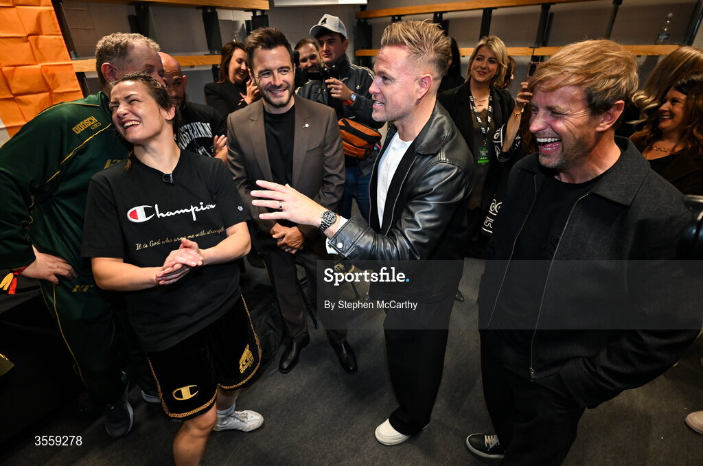 5 September 2026; Katie Taylor, left, with from left, Shane Filan, Nicky Byrne and Kian Egan of Westlife after her undisputed super lightweight championship fight with Flora Pili at the Once Upon A Time fight night in Croke Park, Dublin. Photo by Stephen McCarthy/Sportsfile