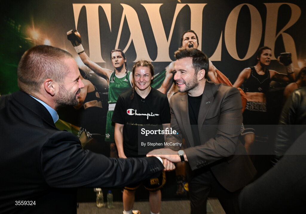 5 September 2026; Katie Taylor in her dressing room with Matchroom Boxing CEO Frank Smith, left, and Shane Filan of Westlife following her undisputed super lightweight championship fight victory over Flora Pili at the Once Upon A Time fight night in Croke Park, Dublin. Photo by Stephen McCarthy/Sportsfile