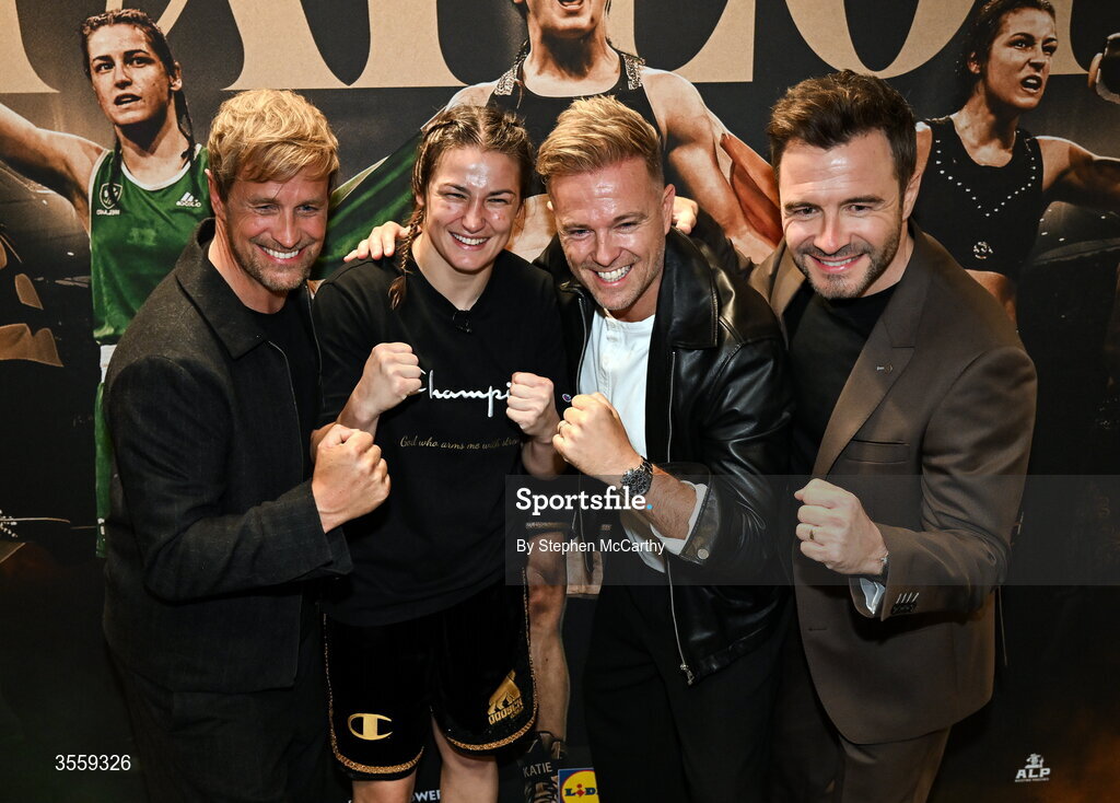 5 September 2026; Katie Taylor in her dressing room, with members of Westlife, from left, Kian Egan, Nicky Byrne and Shane Filan following her undisputed super lightweight championship fight victory over Flora Pili at the Once Upon A Time fight night in Croke Park, Dublin. Photo by Stephen McCarthy/Sportsfile