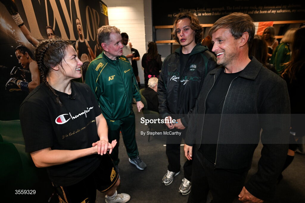 5 September 2026; Katie Taylor in her dressing room with manager Brian Peters and Kian Egan of Westlife and his son Koa following her undisputed super lightweight championship fight victory over Flora Pili at the Once Upon A Time fight night in Croke Park, Dublin. Photo by Stephen McCarthy/Sportsfile