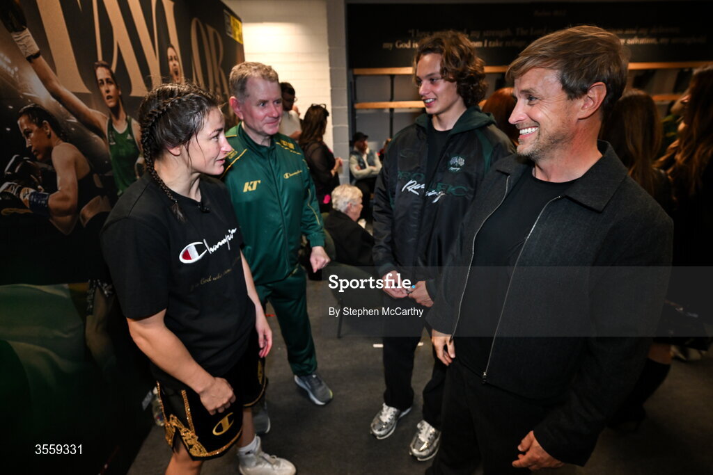 5 September 2026; Katie Taylor in her dressing room with manager Brian Peters and Kian Egan of Westlife and his son Koa following her undisputed super lightweight championship fight victory over Flora Pili at the Once Upon A Time fight night in Croke Park, Dublin. Photo by Stephen McCarthy/Sportsfile