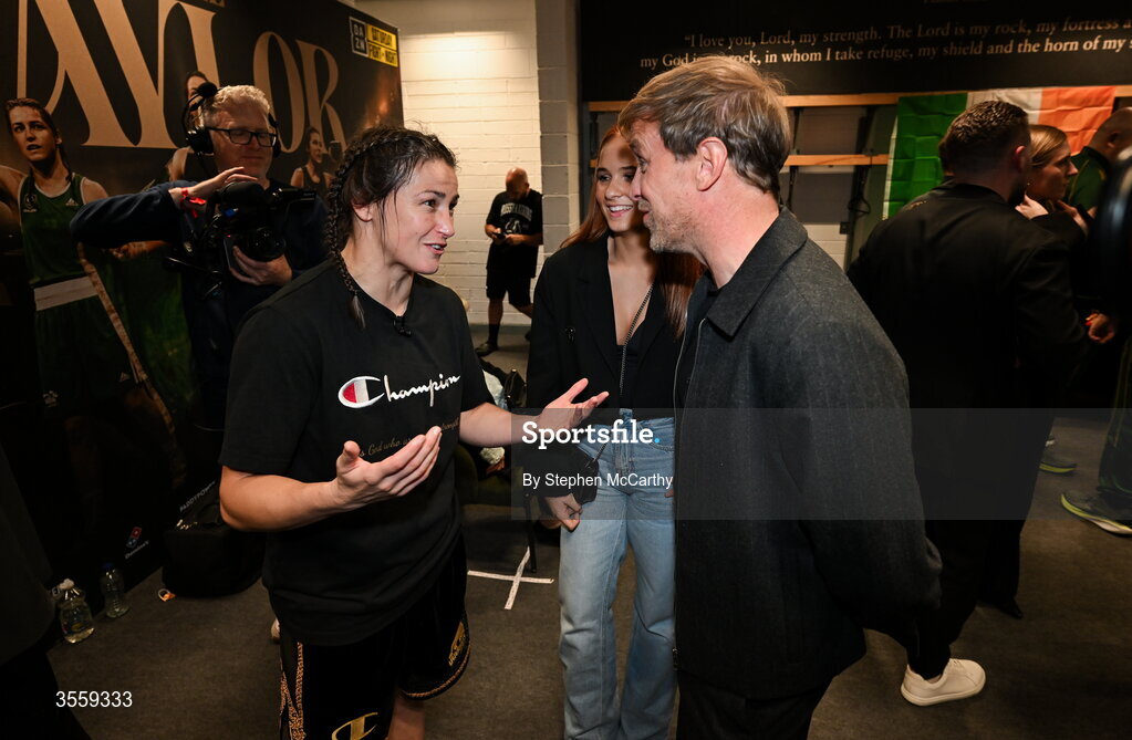 5 September 2026; Katie Taylor with Kian Egan of Westlife and his niece Jersey Fogg in her dressing room following her undisputed super lightweight championship fight victory over Flora Pili at the Once Upon A Time fight night in Croke Park, Dublin. Photo by Stephen McCarthy/Sportsfile