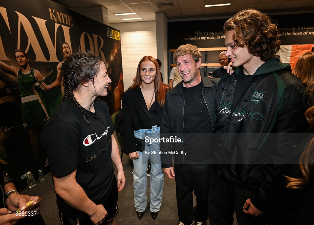 5 September 2026; Katie Taylor in her dressing room with Westlife's Kian Egan, his son Koa and niece Jersey Fogg, following her undisputed super lightweight championship fight victory over Flora Pili at the Once Upon A Time fight night in Croke Park, Dublin. Photo by Stephen McCarthy/Sportsfile