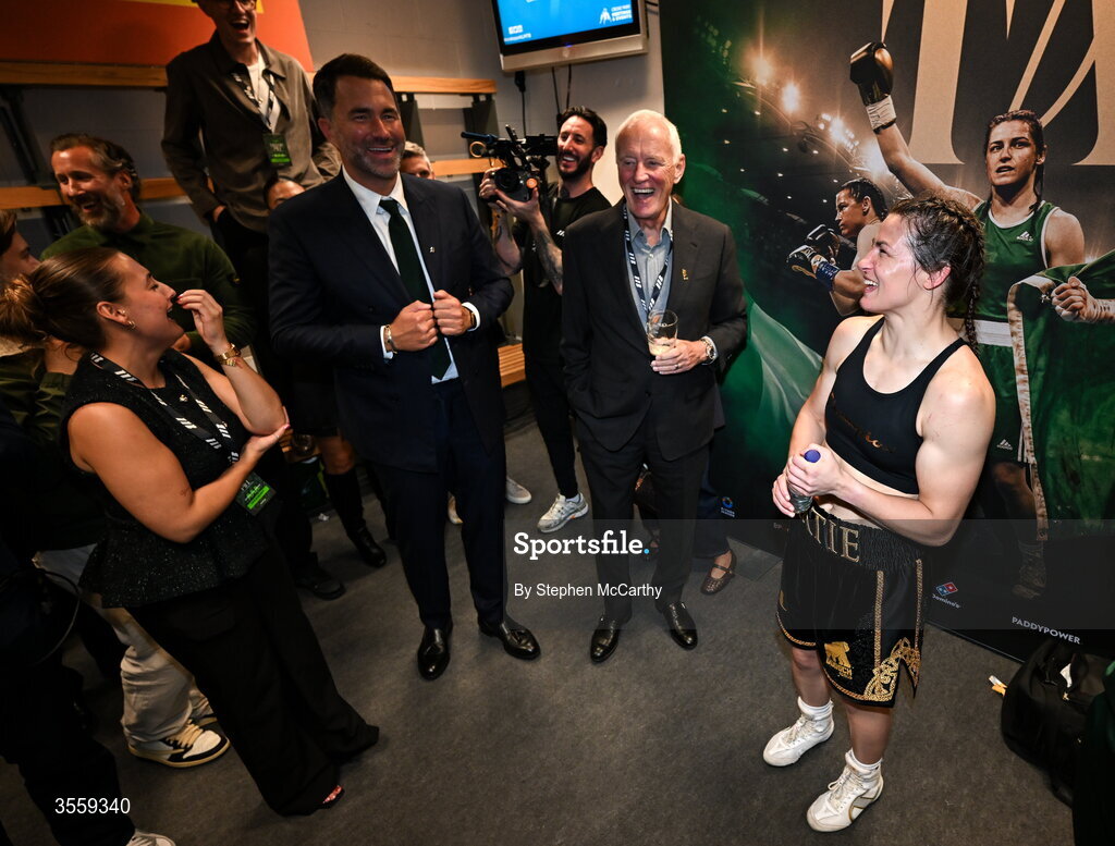 5 September 2026; Katie Taylor in her dressing room with Chairman of Matchroom Sports Eddie Hearn, left, and President of Matchroom Sport Barry Hearn following her undisputed super lightweight championship fight victory over Flora Pili at the Once Upon A Time fight night in Croke Park, Dublin. Photo by Stephen McCarthy/Sportsfile