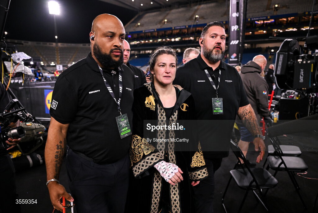 5 September 2026; Katie Taylor leaves the ring area with security following her undisputed super lightweight championship fight victory over Flora Pili at the Once Upon A Time fight night in Croke Park, Dublin. Photo by Stephen McCarthy/Sportsfile