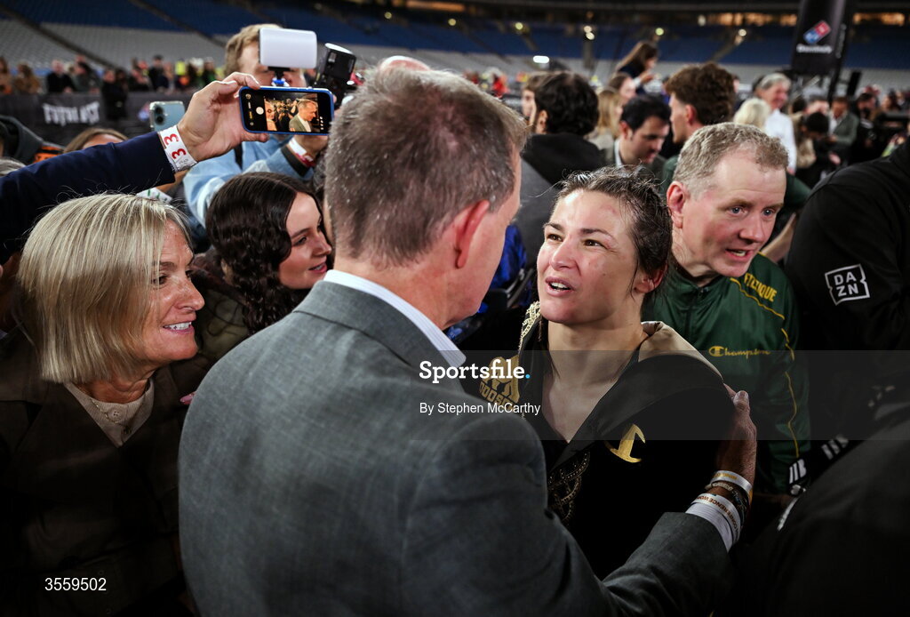 5 September 2026; Katie Taylor with boxing commentator Adam Smith after her undisputed super lightweight championship fight victory over Flora Pili at the Once Upon A Time fight night in Croke Park, Dublin. Photo by Stephen McCarthy/Sportsfile