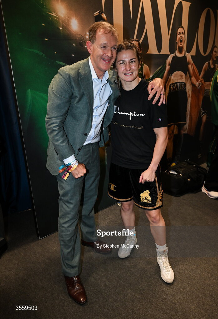 5 September 2026; Katie Taylor with boxing commentator Adam Smith in her dressing room following her undisputed super lightweight championship fight victory over Flora Pili at the Once Upon A Time fight night in Croke Park, Dublin. Photo by Stephen McCarthy/Sportsfile