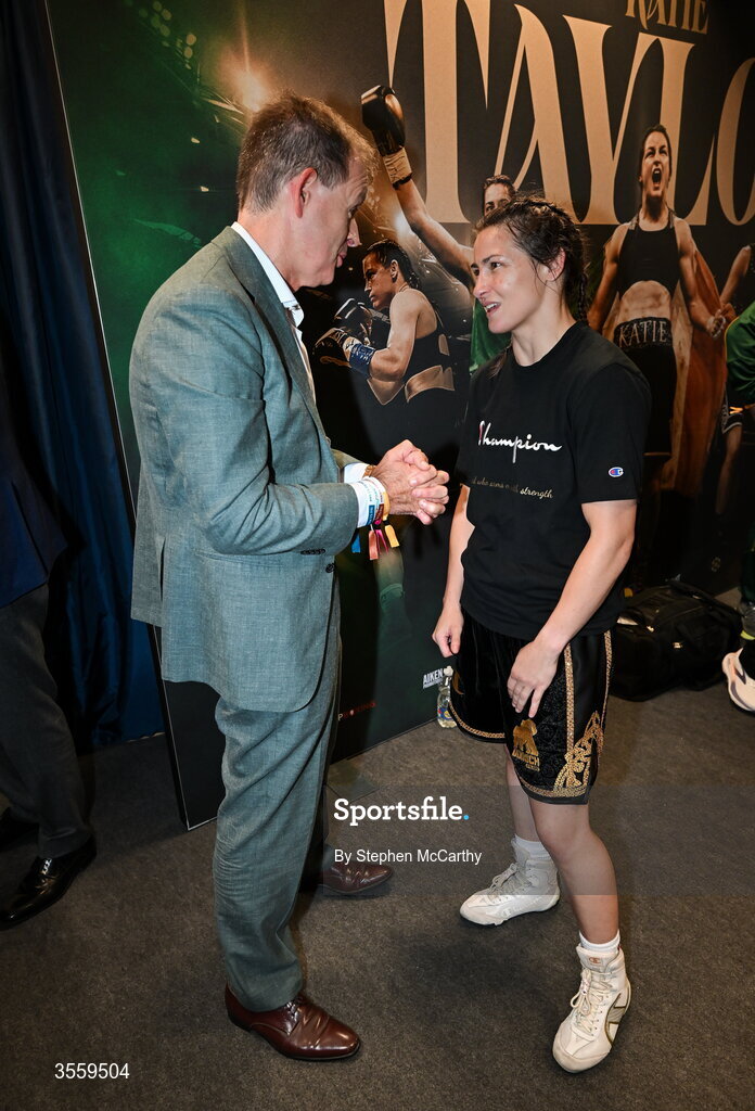 5 September 2026; Katie Taylor with boxing commentator Adam Smith in her dressing room following her undisputed super lightweight championship fight victory over Flora Pili at the Once Upon A Time fight night in Croke Park, Dublin. Photo by Stephen McCarthy/Sportsfile