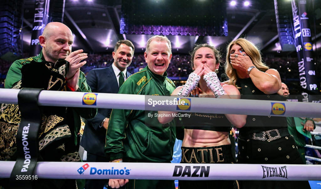 5 September 2026; Katie Taylor celebrates, alongside her team, from left, Tomas Rohan, Chairman of Matchroom Sports Eddie Hearn, manager Brian Peters and mother Bridget following her undisputed super lightweight championship fight victory over Flora Pili at the Once Upon A Time fight night in Croke Park, Dublin. Photo by Stephen McCarthy/Sportsfile