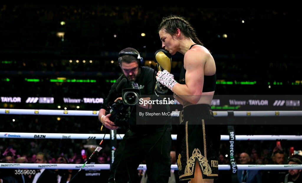 5 September 2026; Katie Taylor places her gloves onto the centre of the ring after her undisputed super lightweight championship fight with Flora Pili at the Once Upon A Time fight night in Croke Park, Dublin.  Photo by Stephen McCarthy/Sportsfile