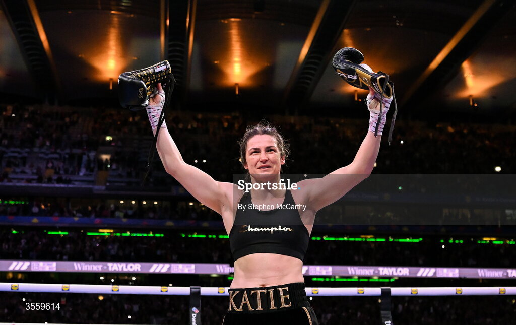 5 September 2026; Katie Taylor holds up her gloves following her undisputed super lightweight championship fight victory over Flora Pili, and her final fight, at the Once Upon A Time fight night in Croke Park, Dublin. Photo by Stephen McCarthy/Sportsfile