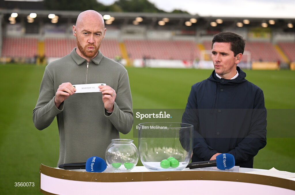 6 September 2026; Former Dundalk and current Linfield player Chris Shields, left, draws the name of Bohemians in the Club Orange Men’s FAI Cup semi-final draw, in the company of former Derry City player Gareth McGlynn, after the Club Orange Men’s FAI Cup quarter-final match between Derry City and Dundalk at The Ryan McBride Brandywell Stadium in Derry. Photo by Ben McShane/Sportsfile