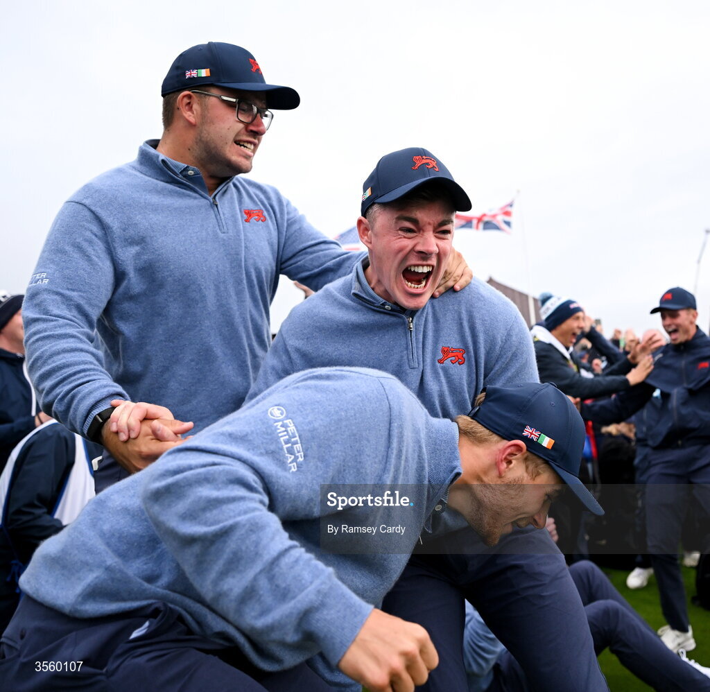 6 September 2026; Great Britain and Ireland players, from left, Eliot Baker, Stuart Grehan and Connor Graham celebrate winning The Walker Cup on day two of the 51st Walker Cup at Lahinch Golf Club in Lahinch, Clare. Photo by Ramsey Cardy/Sportsfile