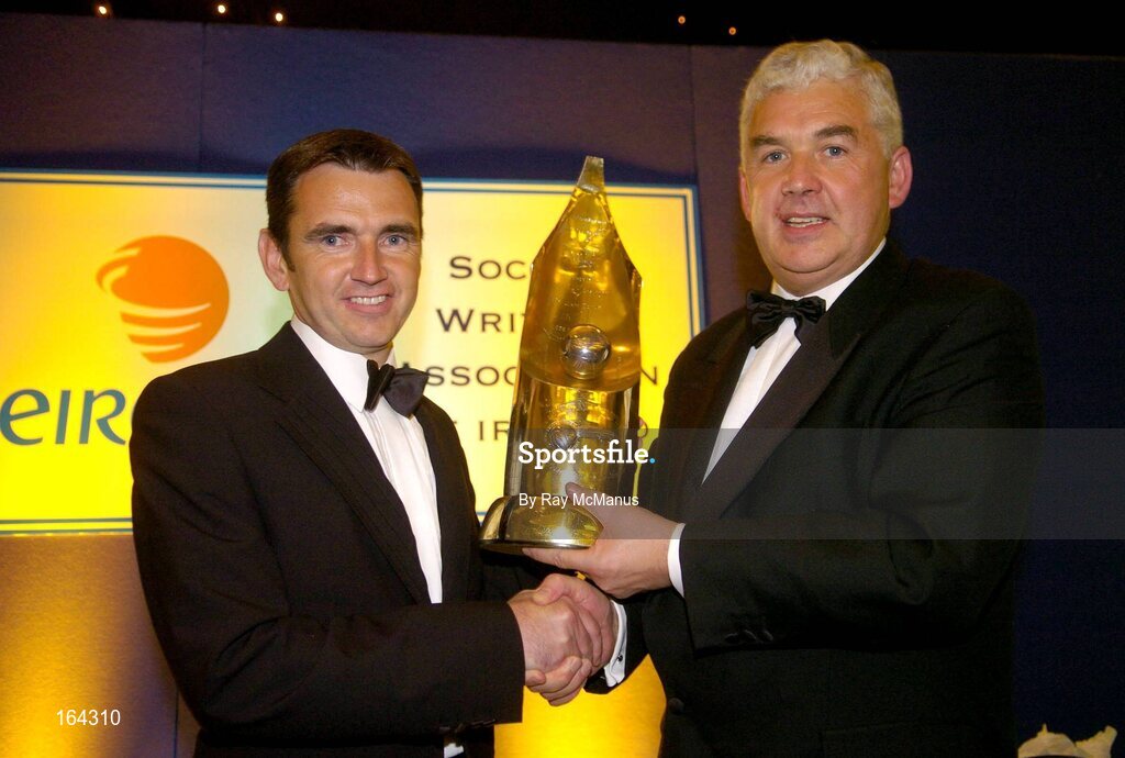 15 January 2005; Cathal Magee, Managing Director, eircom Retail, presents the eircom / Soccer Writers Association of Ireland 'Personality of the Year' award to Shelbourne manager Pat Fenlon. eircom / SWAI Personality of the Year Award, Rochestown Park Hotel, Rochestown, Cork. Picture credit; Ray McManus / SPORTSFILE