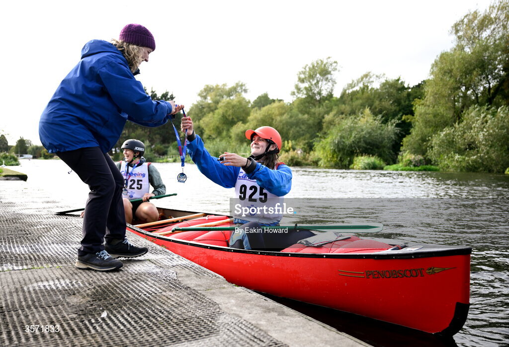 19 September 2026; Emer Carton hands medals to Ava Evans and Claire Martin after competing in the event during the 65th International Liffey Descent at Dublin University Boat Club in Kilmainham, Dublin. Photo by Eakin Howard/Sportsfile