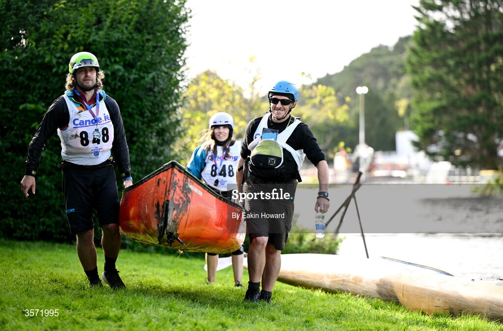 19 September 2026; Colette Hartnett of White Water, Mark McGrath and Stephen Whittle of QQi take their canoe our of the water after competing in the Open Canoe - Triple  Canadian Canoe event during the 65th International Liffey Descent at Dublin University Boat Club in Kilmainham, Dublin. Photo by Eakin Howard/Sportsfile