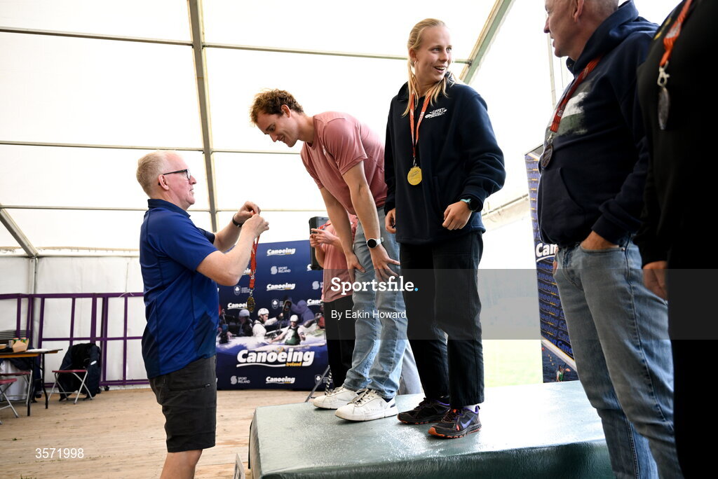 19 September 2026; Joe Peterson of Banbury Canoe Club and Sam Martyn of Wey Kayak Club receive their gold medals on the podium after K2 Mixed competition during the 65th International Liffey Descent at Dublin University Boat Club in Kilmainham, Dublin. Photo by Eakin Howard/Sportsfile