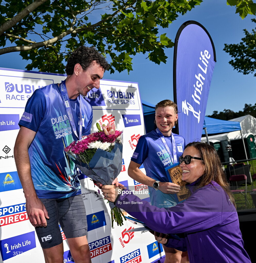 20 September 2026; Barbara O’Malley, Chief People Officer, Irish Life, makes a presentation to the Men's winner James Hyland, Raheny Shamrocks, after the 2026 Irish Life Dublin Half Marathon, which took place on Sunday 20th September in Phoenix Park, marking the final event of the 2026 Irish Life Dublin Race Series. Photo by Sam Barnes/Sportsfile