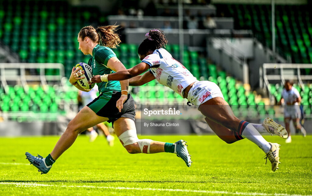 20 September 2026; Eve Higgins of Ireland scores her side's fourth try despite the efforts of Erica Coulibaly of USA during the WXV Global Series match between Ireland and USA at Tallaght Stadium in Dublin. Photo by Shauna Clinton/Sportsfile