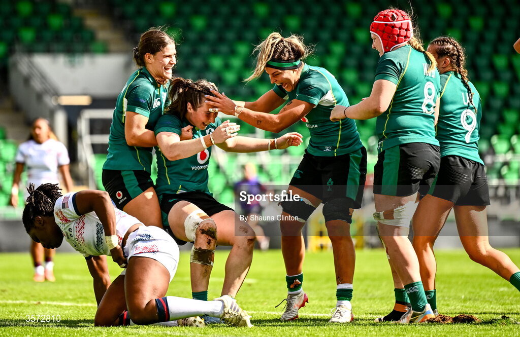 20 September 2026; Eve Higgins of Ireland, centre, is congratulated by team-mates after scoring her side's fourth try despite the efforts of Erica Coulibaly of USA during the WXV Global Series match between Ireland and USA at Tallaght Stadium in Dublin. Photo by Shauna Clinton/Sportsfile