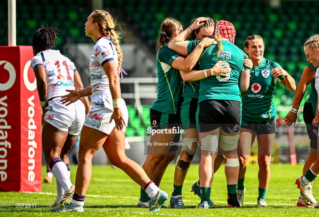 20 September 2026; Eve Higgins of Ireland, centre, is congratulated by team-mates after scoring her side's fourth try despite the efforts of Erica Coulibaly of USA during the WXV Global Series match between Ireland and USA at Tallaght Stadium in Dublin. Photo by Shauna Clinton/Sportsfile