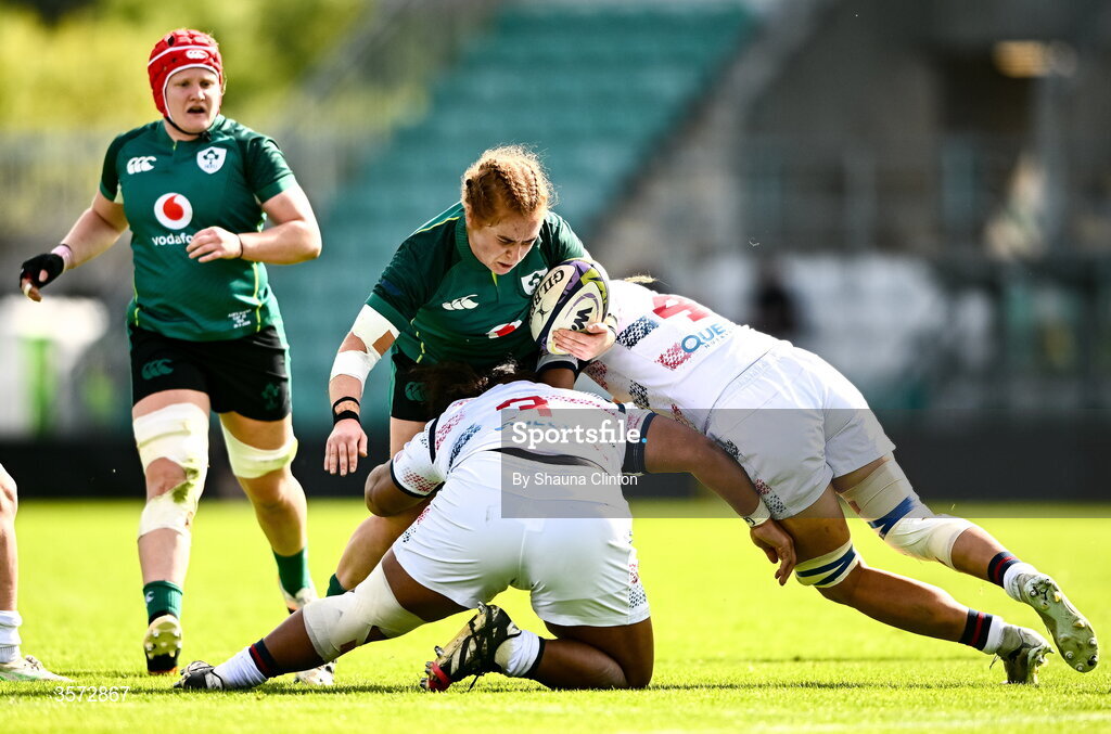 20 September 2026; Niamh O'Dowd of Ireland is tackled by USA players, from left, Keia Mae Sagapolu - Senele and Hallie Taufoou during the WXV Global Series match between Ireland and USA at Tallaght Stadium in Dublin. Photo by Shauna Clinton/Sportsfile