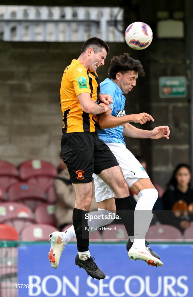 20 September 2026; Sean Cummins of Cobh Wanderers in action against Bradley Walsh of St Mary's AFC during the 2026 FAI Intermediate Cup Final between Cobh Wanderers and St Mary's at Munster FA Turners Cross Stadium in Cork. Photo by Eakin Howard/Sportsfile