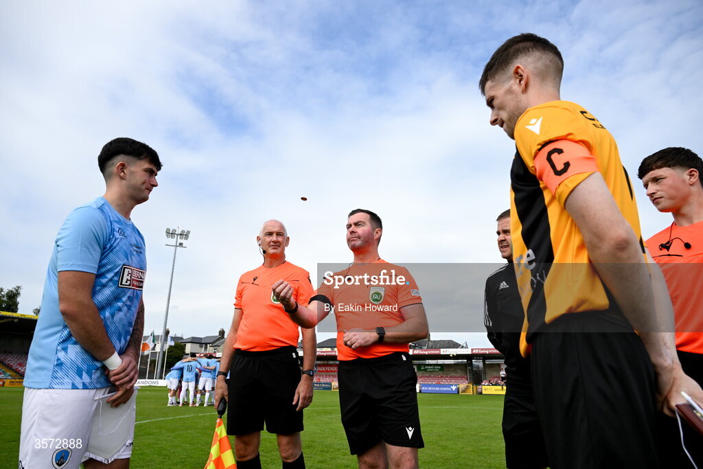 20 September 2026; Team captains Dan Ryan Fortune of St Mary's AFC and David Curran of Cobh Wanderers stand with referees Robert O'Leary, Tom McCarthy, Bobby Coonan, Allan Martin for the coin toss before the 2026 FAI Intermediate Cup Final between Cobh Wanderers and St Mary's at Munster FA Turners Cross Stadium in Cork. Photo by Eakin Howard/Sportsfile