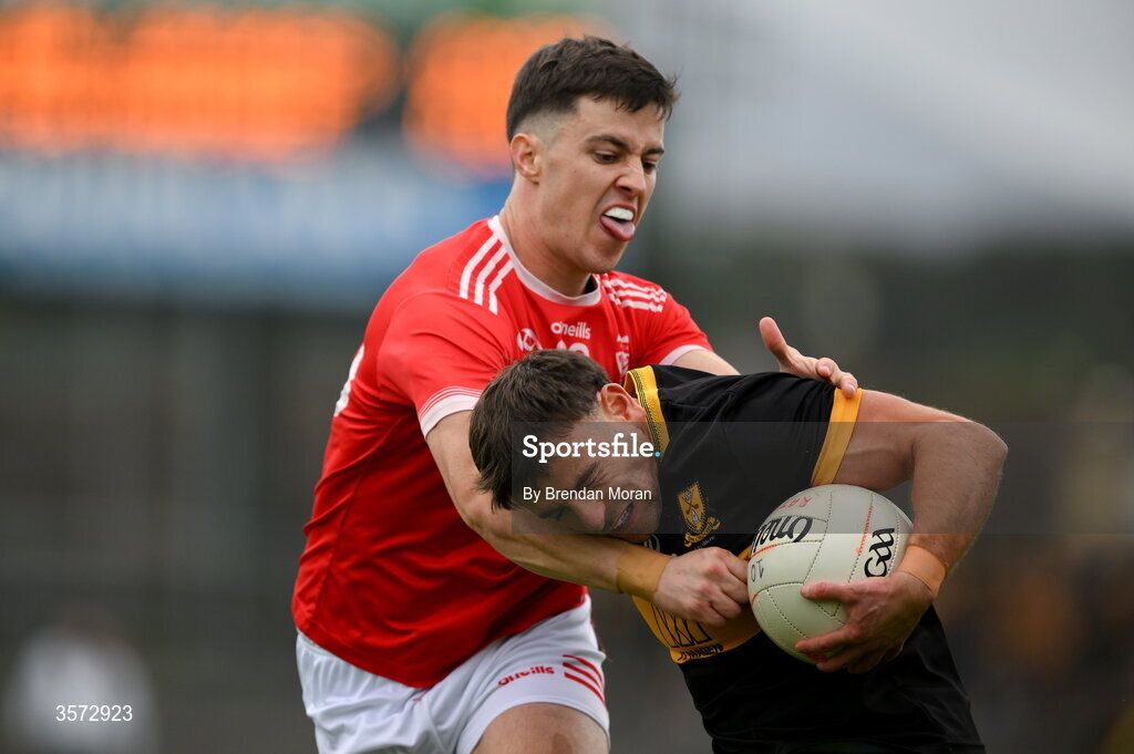20 September 2026; Micheal Burns of Dr Crokes is tackled by Fionn Holohan of Rathmore during the Kerry Senior Club Football Championship Final between Dr Crokes and Rathmore at Fitzgerald Stadium in Killarney, Kerry. Photo by Brendan Moran/Sportsfile
