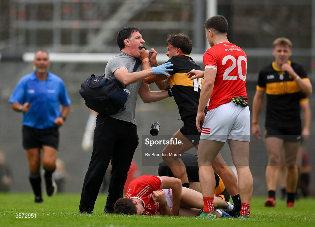 20 September 2026; Micheal Burns of Dr Crokes tussles with the Rathmore physiotherapist Michael Kelliher for which Burns was shown a red card and the physio was shown a yellow card, during the Kerry Senior Club Football Championship Final between Dr Crokes and Rathmore at Fitzgerald Stadium in Killarney, Kerry. Photo by Brendan Moran/Sportsfile
