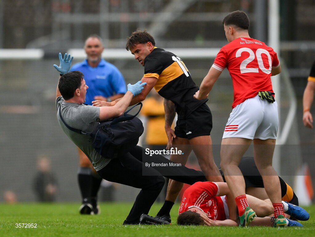 20 September 2026; Micheal Burns of Dr Crokes tussles with the Rathmore physiotherapist Michael Kelliher for which Burns was shown a red card and the physio was shown a yellow card, during the Kerry Senior Club Football Championship Final between Dr Crokes and Rathmore at Fitzgerald Stadium in Killarney, Kerry. Photo by Brendan Moran/Sportsfile