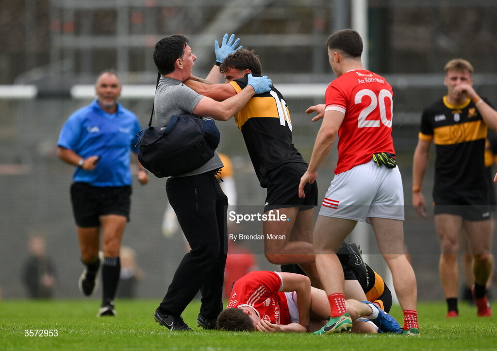 20 September 2026; Micheal Burns of Dr Crokes tussles with Rathmore physiotherapist Michael Kelliher for which Burns was shown a red card and the physio was shown a yellow card, during the Kerry Senior Club Football Championship Final between Dr Crokes and Rathmore at Fitzgerald Stadium in Killarney, Kerry. Photo by Brendan Moran/Sportsfile