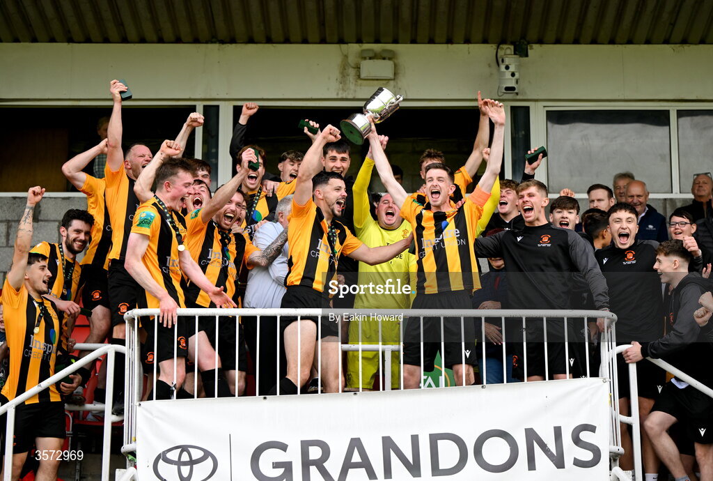 20 September 2026; Cobh Wanderers celebrate with the trophy after winning the 2026 FAI Intermediate Cup Final between Cobh Wanderers and St Mary's at Munster FA Turners Cross Stadium in Cork. Photo by Eakin Howard/Sportsfile