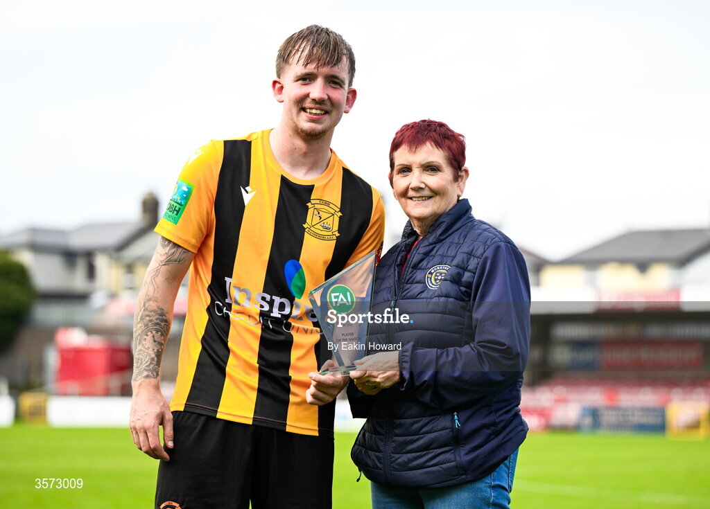 20 September 2026; Player of the Match Ciaran Griffin of Cobh Wanderers with board member and Director of Football at the FAI, Geraldine Nagle, after the 2026 FAI Intermediate Cup Final between Cobh Wanderers and St Mary's at Munster FA Turners Cross Stadium in Cork. Photo by Eakin Howard/Sportsfile