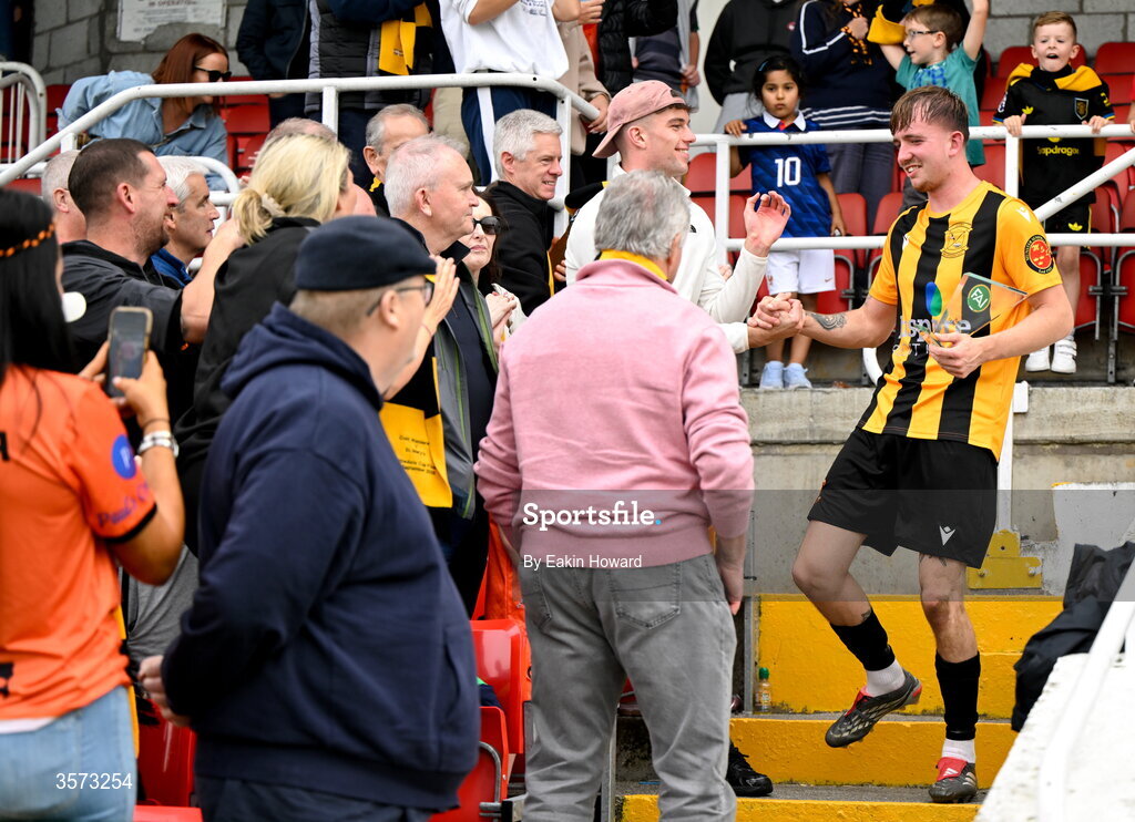 20 September 2026; Ciaran Griffin of Cobh Wanderers celebrates with supporters after accepting the Player of the Match award after the 2026 FAI Intermediate Cup Final between Cobh Wanderers and St Mary's at Munster FA Turners Cross Stadium in Cork. Photo by Eakin Howard/Sportsfile