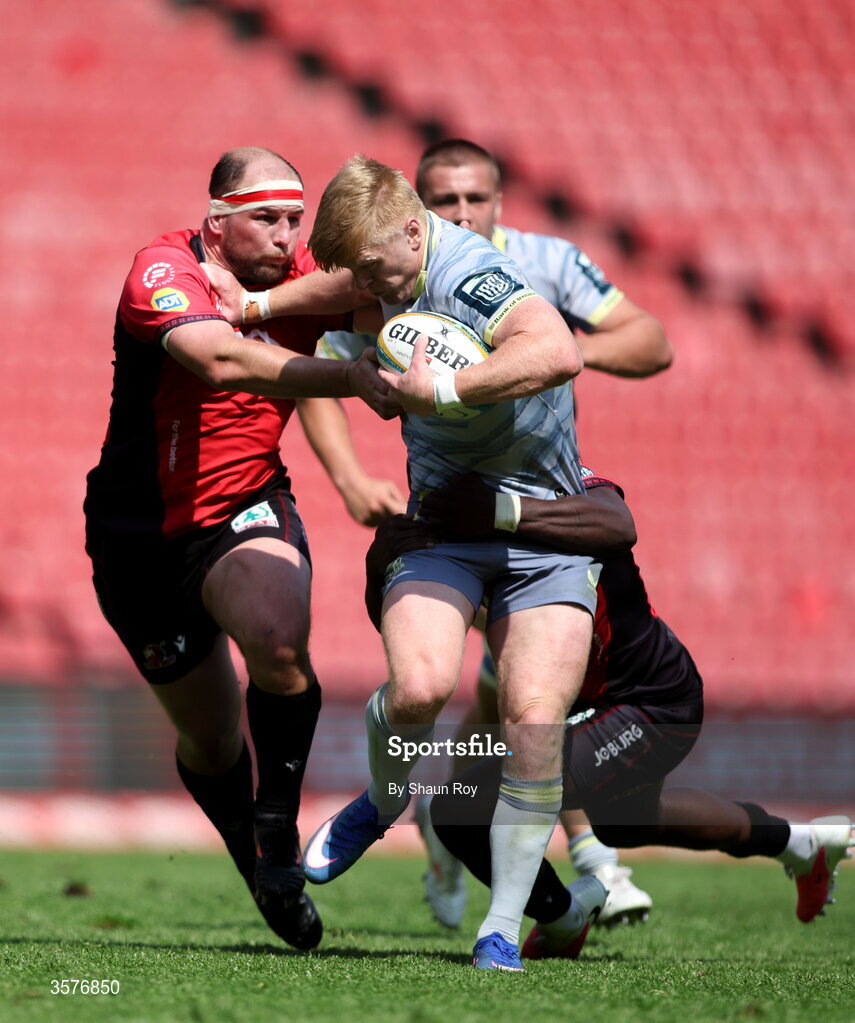 26 September 2026; Tommy O'Brien of Leinster is tackled by PJ Botha, left, and Kelly Mpeku of 10bet Lions during the United Rugby Championship match between Lions and Leinster at Ellis Park in Johannesburg, South Africa. Photo by Shaun Roy/Sportsfile