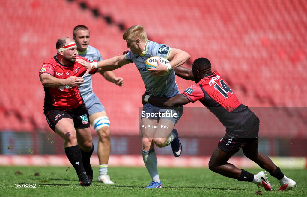 26 September 2026; Tommy O'Brien of Leinster is tackled by PJ Botha, left, and Kelly Mpeku of 10bet Lions during the United Rugby Championship match between Lions and Leinster at Ellis Park in Johannesburg, South Africa. Photo by Shaun Roy/Sportsfile
